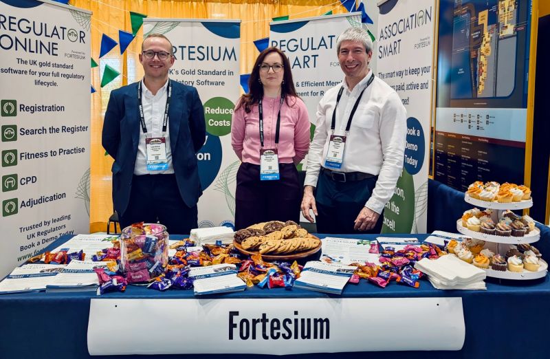 The Fortesium team engaging with visitors at an industry conference stand